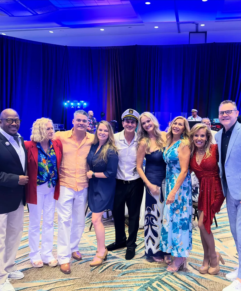 Gala guests share another group photograph in the ballroom.