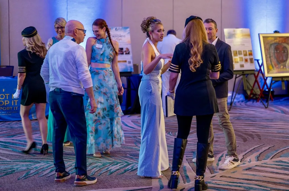 Guests share a conversation at the reception.